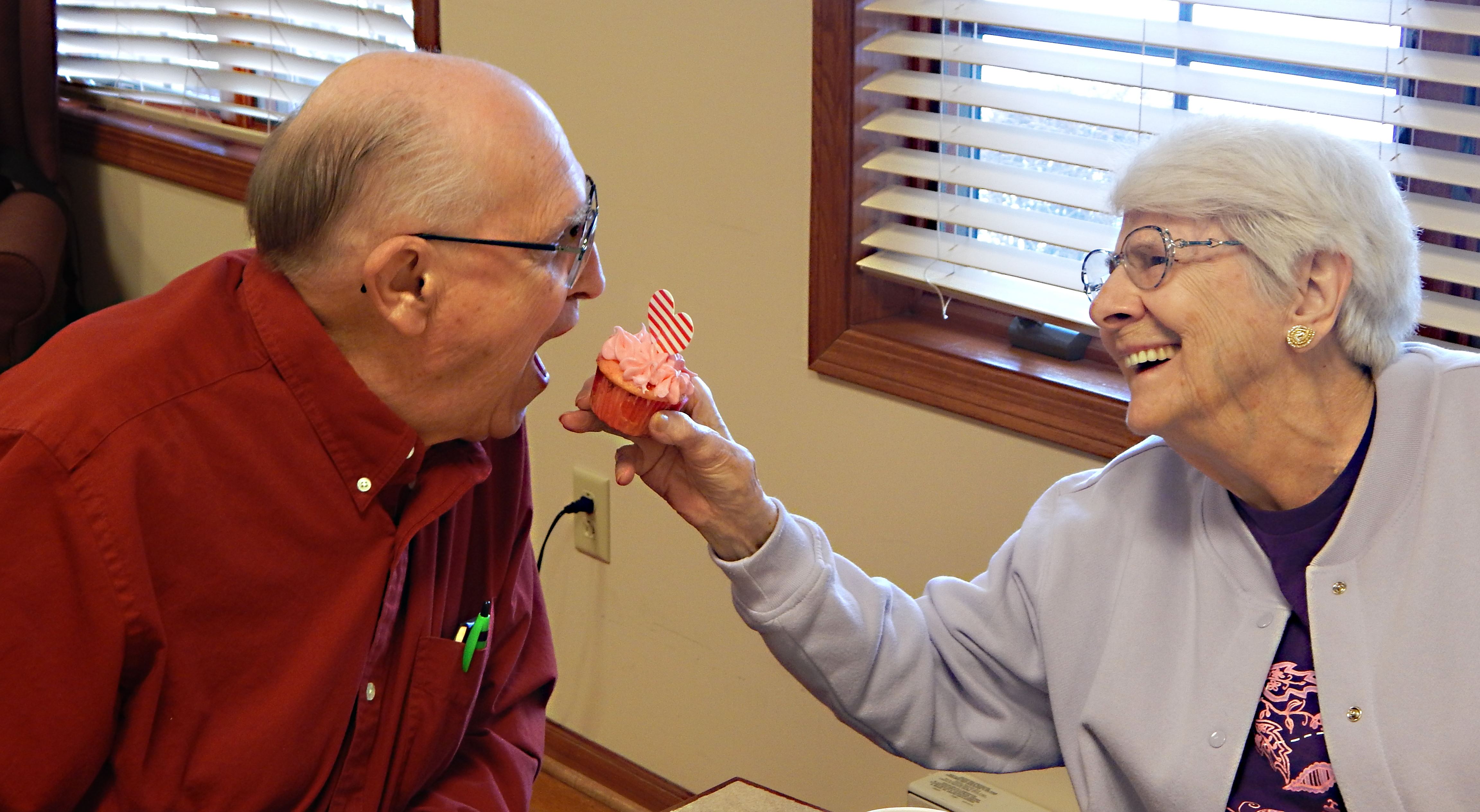 Couple eating a cupcake